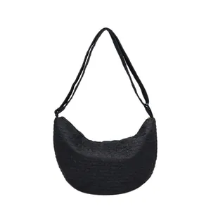Minimalist black woven texture half-moon crossbody bag with adjustable shoulder strap