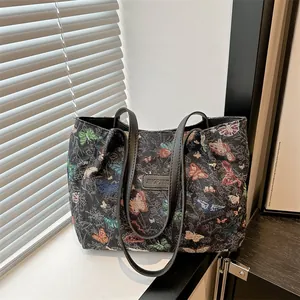 Canvas tote bag with butterfly embroidery and leather handles for high school students