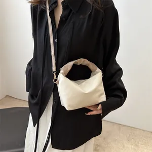 Minimalist pleated beige crossbody handbag with stylish coffee brown wrinkled handle