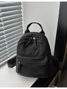 Mini black canvas backpack for women and couples, stylish 2024 casual travel daypack