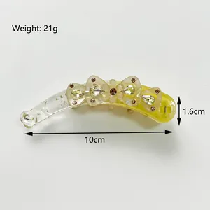 Barrette banane en résine avec nœud en cristal et dimensions détaillées
