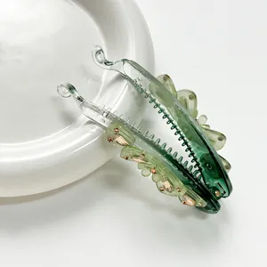 Pince à cheveux banane verte transparente avec strass bruns pour coiffure queue de cheval