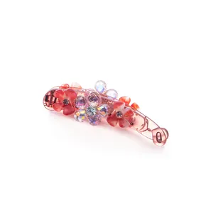 Pink resin banana hair clip with red flowers and sparkling crystals for women
