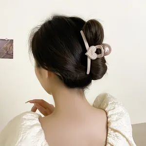 Elegant cream heart claw clip for thick hair with Baguette France lettering detail