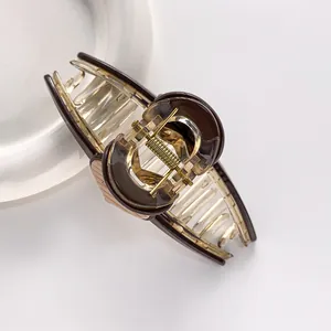 Elegant large heart hair claw clip in brown and clear resin for thick hair styling