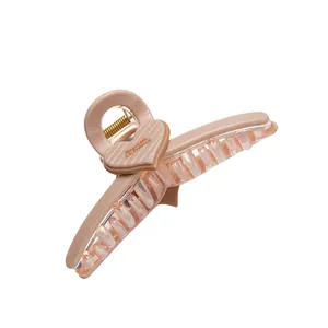 Pink heart claw clip for women with matte finish and Barrette La France gold lettering