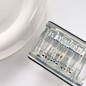 Close-up of rectangular hair claw clip with black trim and hollowed stripe design