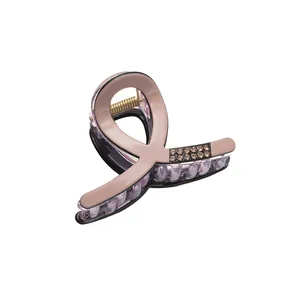 Elegant dusty pink acrylic hair claw clip with rhinestones and golden metal spring