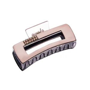 Elegant mauve hair claw clip with sparkling brown rhinestones and purple teeth decoration