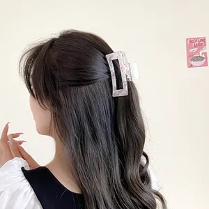 Large pink marble acrylic hair claw clip for women's half-up hairstyle styling