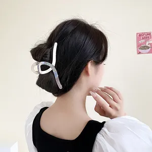 Iridescent oversized hair claw clip for thick hair with a minimalist streamlined design