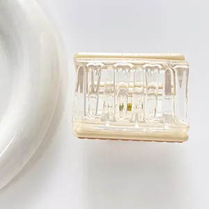 Square striped hair claw clip in cream and clear acrylic finish for daily hairstyling
