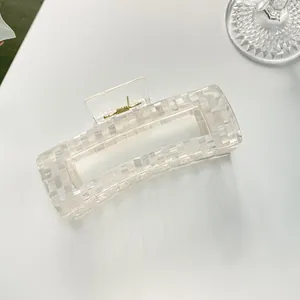 Macro view of extra large square hair claw clip with colorful pearly checkerboard pattern