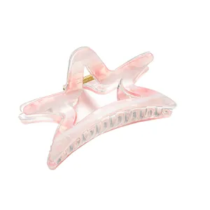 Molla per capelli a stella marina con motivo marmorizzato rosa e molla dorata