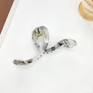Macro shot of 13cm marble texture hair claw clip with elegant grey ink patterns