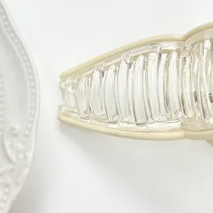 Minimalist large shark hair claw clip in creamy yellow and transparent acrylic style