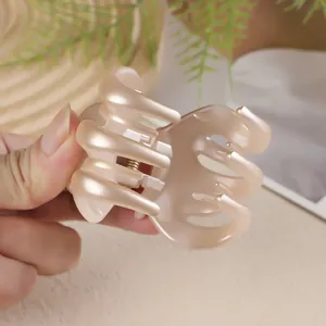 Pearlescent champagne pink pumpkin claw clip for high ponytail styling and hair grip
