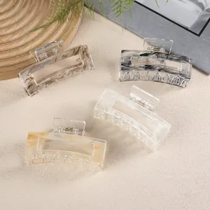 Set of four medium rectangular marble pattern hair claws in assorted elegant colors