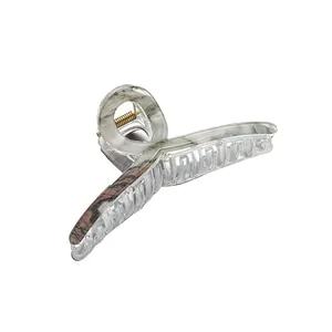 Large marble pattern claw clip with brown wood grain texture and gold spring