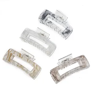 Set of four ink-patterned acetate hair claws in square hollow minimalist design