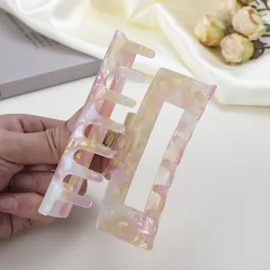 Pinza per capelli quadrata in acetato marmorizzato rosa e giallo, tenuta a mano per capelli