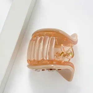 Elegant peach resin star shark hair claw clip with rhinestones for Korean style updos