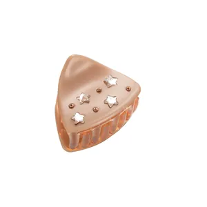 Star-patterned hair claw clip with rhinestones in soft nude pink for women styling