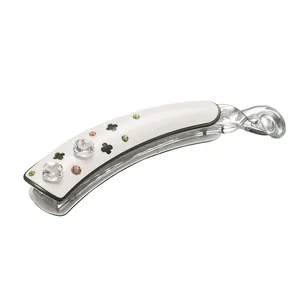 10cm banana hair clip with white acetate, sparkling crystals, and clover cutout detail