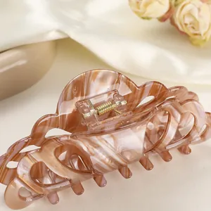 Large marble pattern hair claw clip with wave edges and gold spring for women