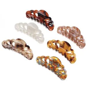 Detailed set of six cellulose acetate claw clips in assorted leopard and marble patterns