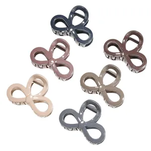 Set of six colorful flower-shaped shark hair claws in glossy finish and minimalist style