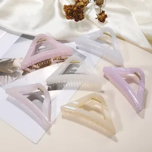Set of six large glossy triangular hair claw clips in elegant pastel pearl colors