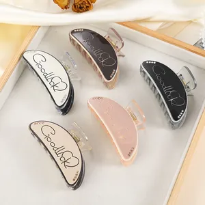 Medium 9cm shark hair clips in five colors with Goodluck script and rhinestones