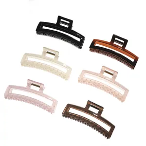 Set of large minimalist rectangular hair claws in six glossy colors on white background