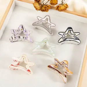 Detailed view of 6 colorful star-shaped hair claws with marble acetate textures