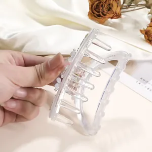 Detail of 9cm transparent claw clip with white flower decor and rhinestones