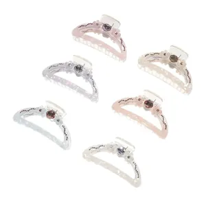 Set of 6 translucent 9cm shark hair clips with pearlescent finish and floral accents