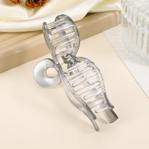Detail shot of the translucent grey acetate hair claw with a durable metal spring