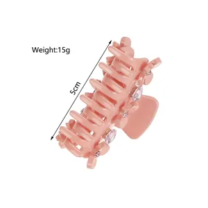 Pink 5cm bow claw clip with sparkling rhinestones for half-up hair styling