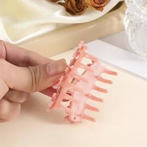 Pink floral claw clip for half-up hairstyles with resin flowers and metal spring detail