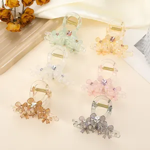 Detailed set of six floral resin hair claws in pastel shades with gemstone accents