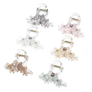 Set of six large acrylic hair claw clips with striped bow and rhinestone accents