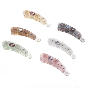 Set of 6 iridescent banana hair clips in various colors with rhinestone flower accents