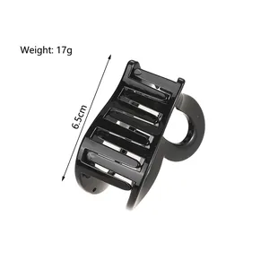 Pinza per capelli nera a cuore con finitura lucida e una lunghezza totale di 6,5 cm