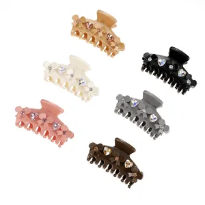 Set of 6 colorful bow hair claws with heart rhinestones shown on a white background