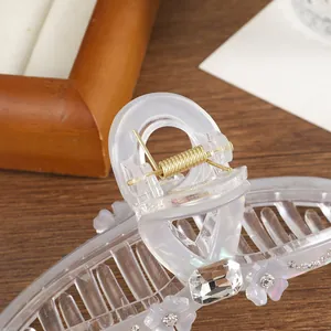 Elegant large floral hair claw clip with rhinestones and gold spring in clear acrylic