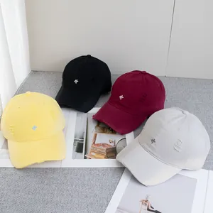Distressed baseball caps with letter embroidery in yellow, black, burgundy, and grey
