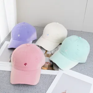 Close-up of vintage-style baseball caps in pastel colors with distressed edge detailing