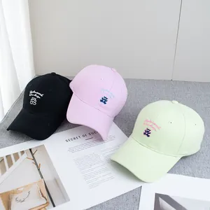 Detailed embroidery of a cute bear on pink, black, and green canvas baseball caps