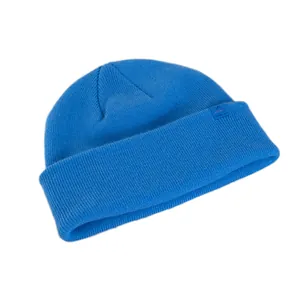 Navy blue 100% wool ribbed knit beanie with mountain logo patch on a plain white background